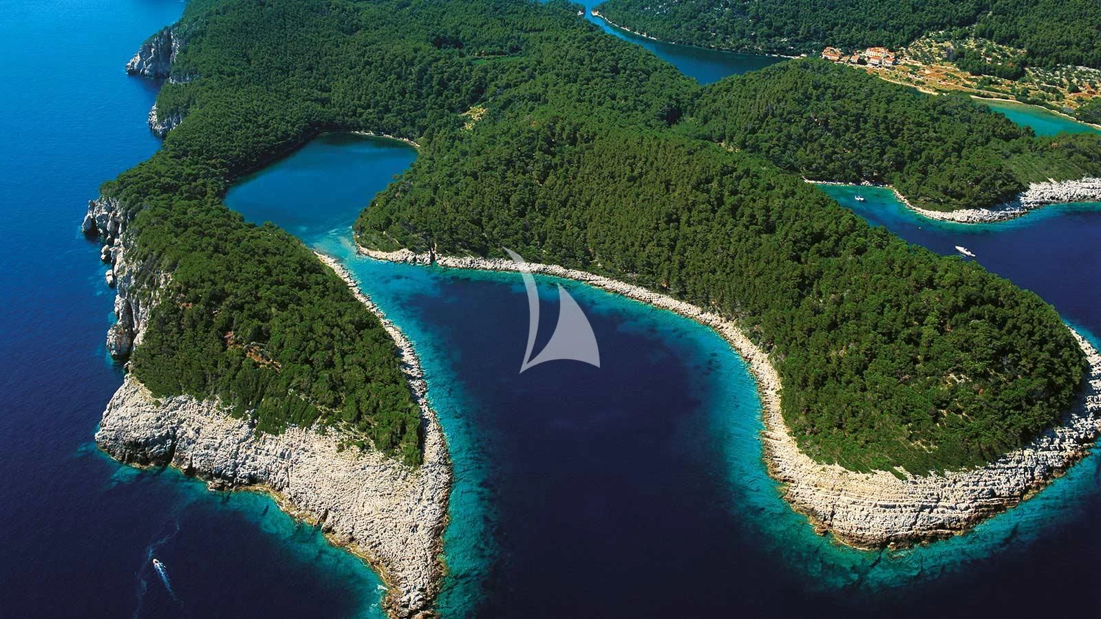 an aerial view of a beach and water aboard AURIANE Yacht for Sale