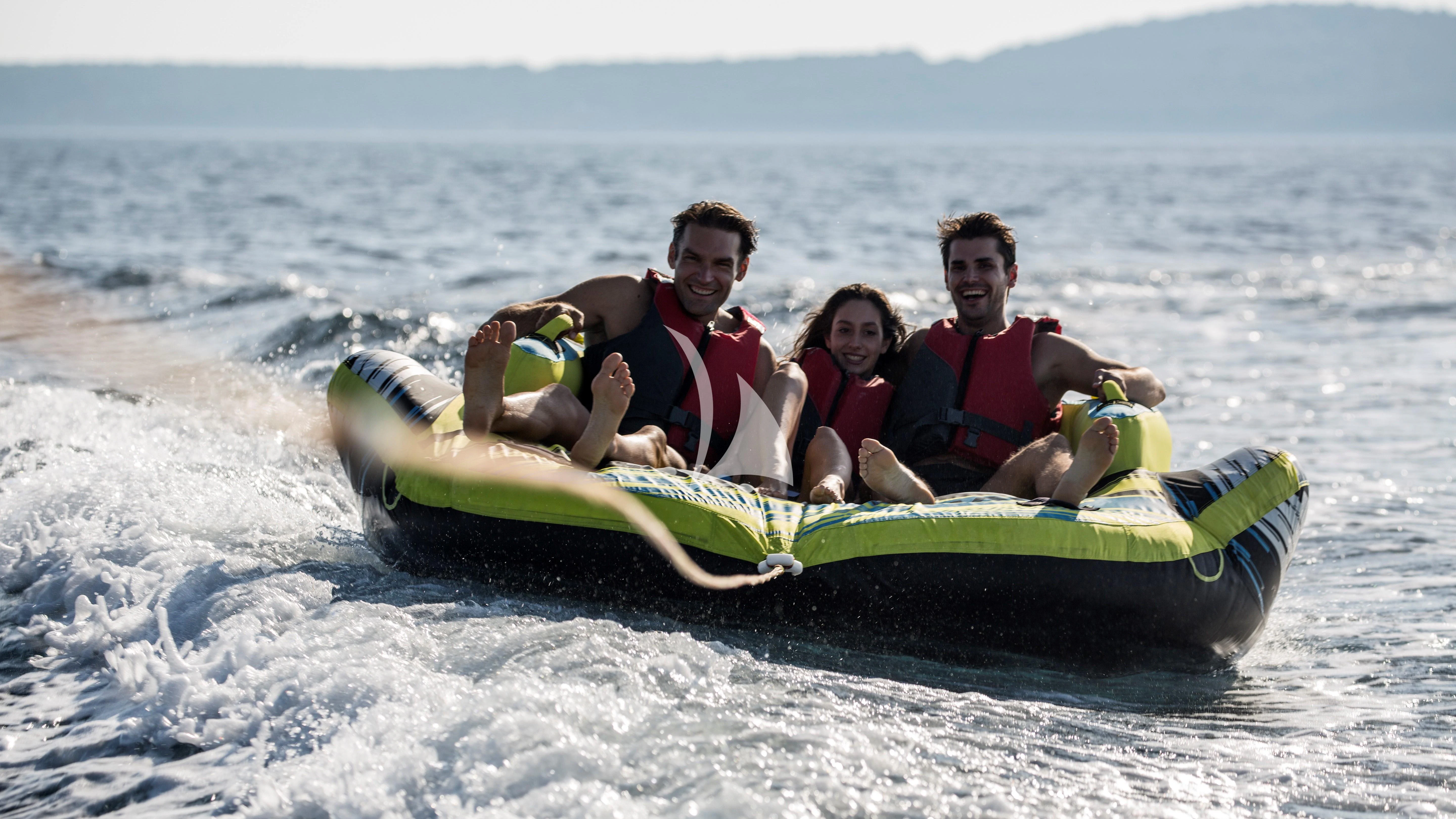 a group of people on a raft in the water aboard AURIANE Yacht for Sale