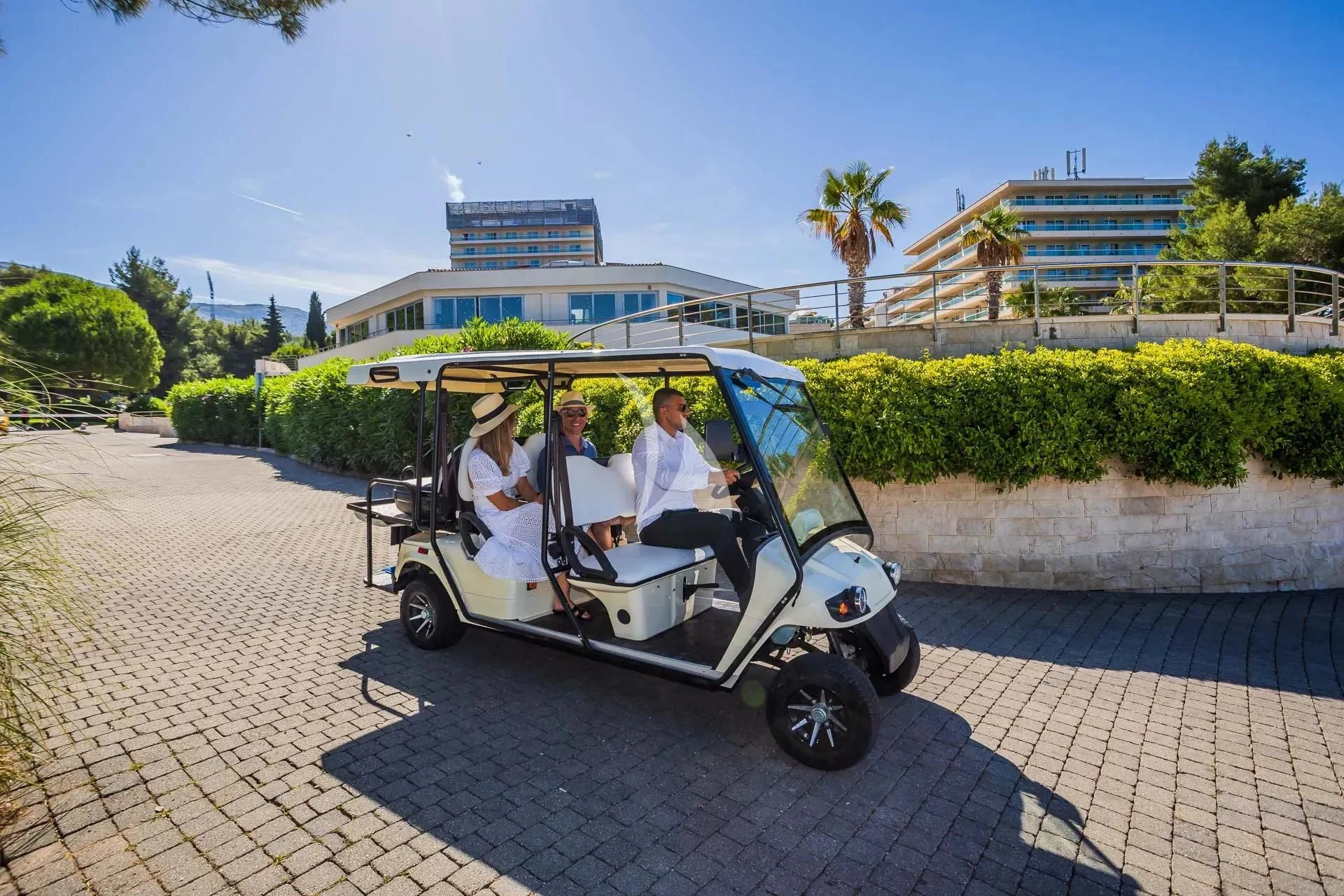 a group of people in a small car aboard AURIANE Yacht for Sale