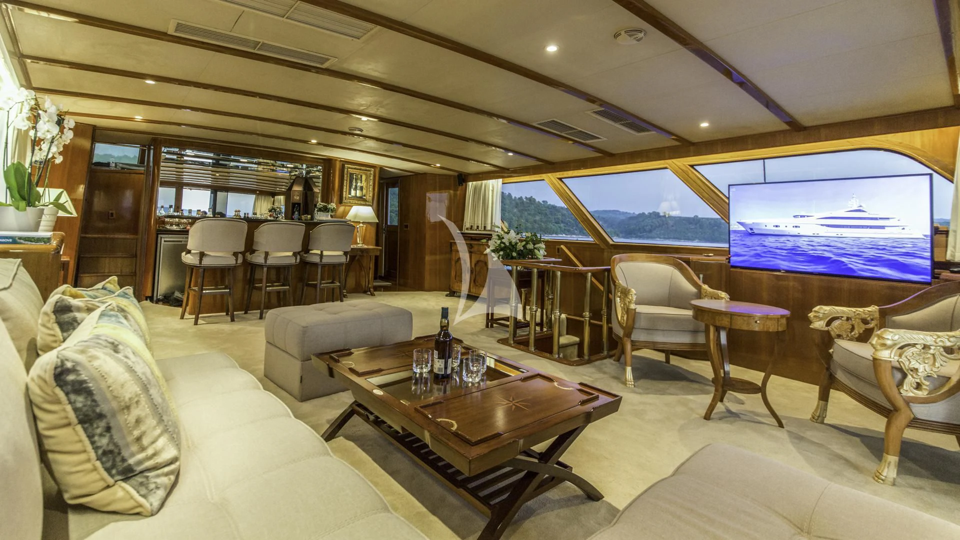 a living room with a large window aboard AURIANE Yacht for Sale