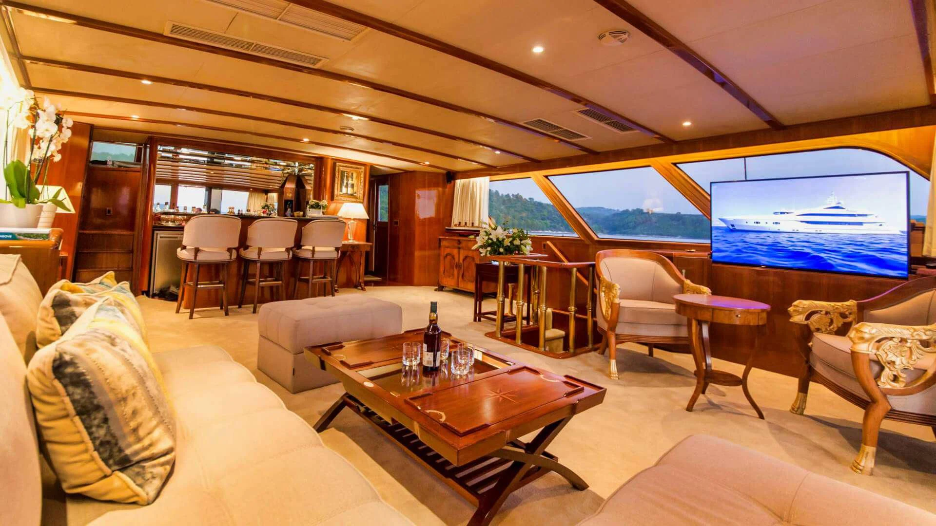 a living room with a large window aboard AURIANE Yacht for Sale