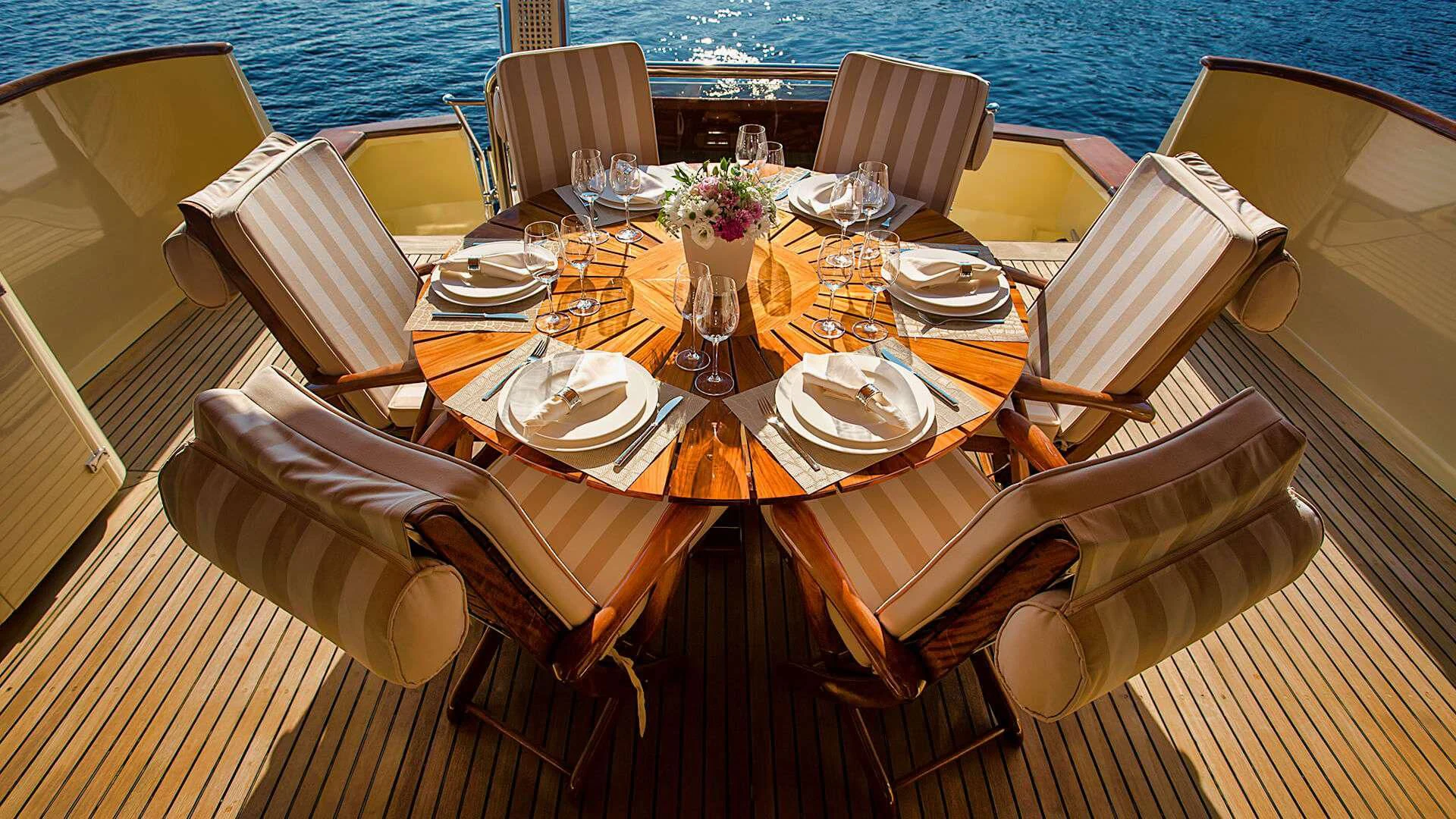 a table set for a dinner aboard AURIANE Yacht for Sale
