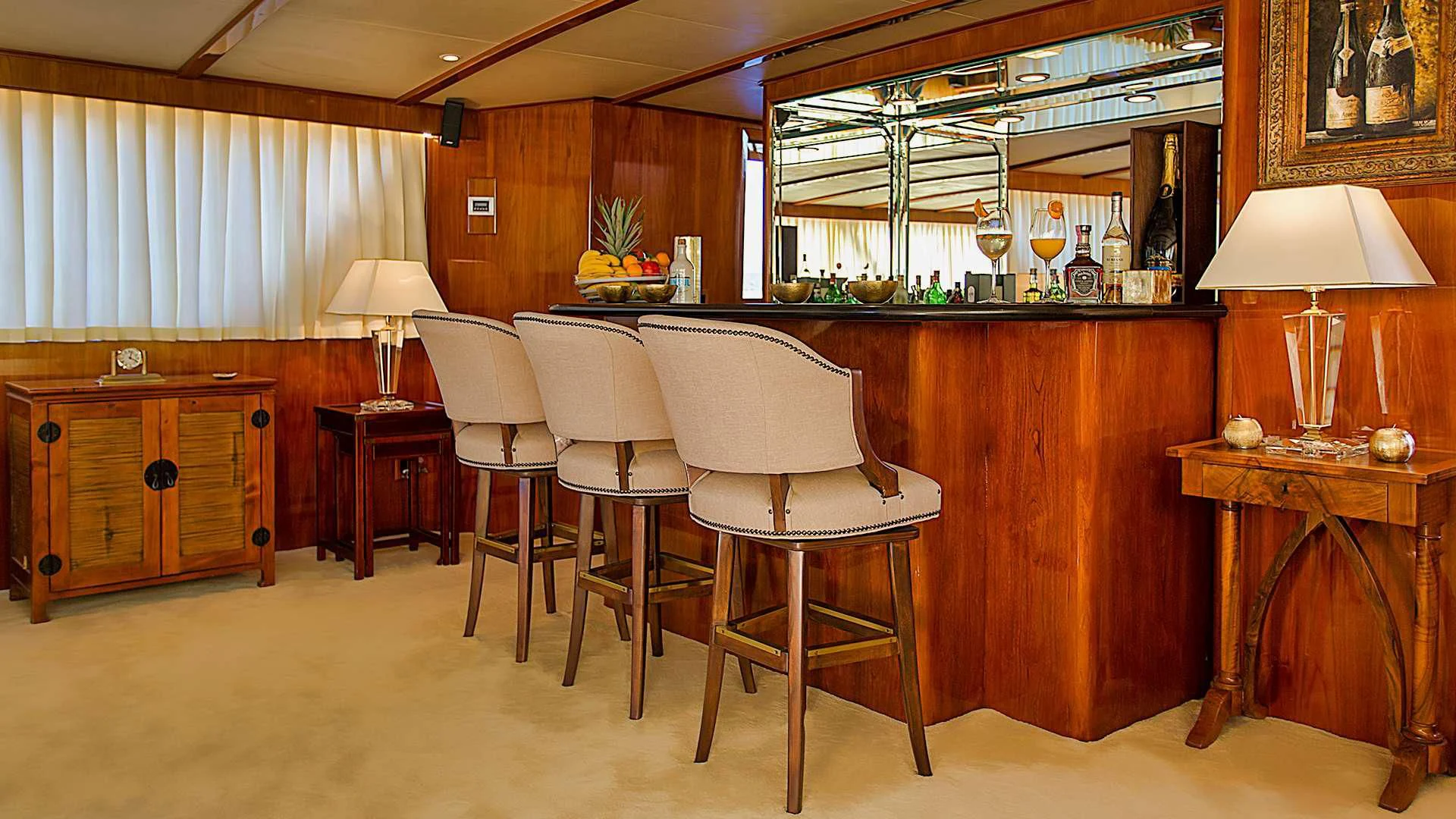 a room with a table chairs and a cabinet aboard AURIANE Yacht for Sale