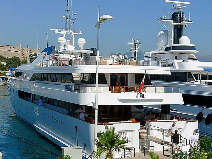 a large white boat with a deck aboard ALWAELI Yacht for Sale