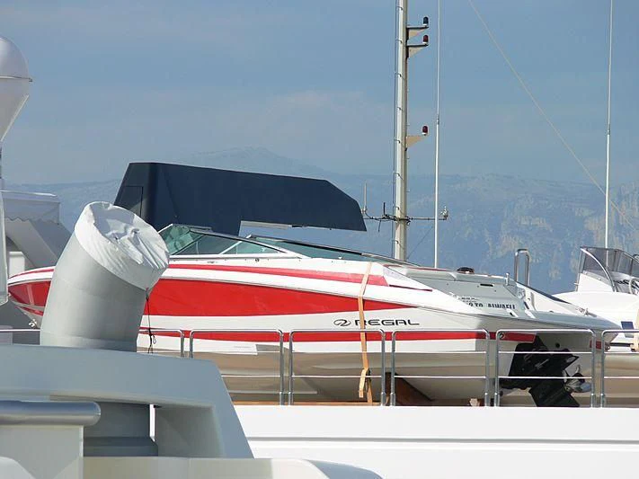 a red and white striped boat aboard ALWAELI Yacht for Sale