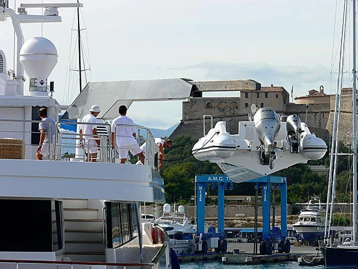 a group of people standing on a boat in the water aboard ALWAELI Yacht for Sale
