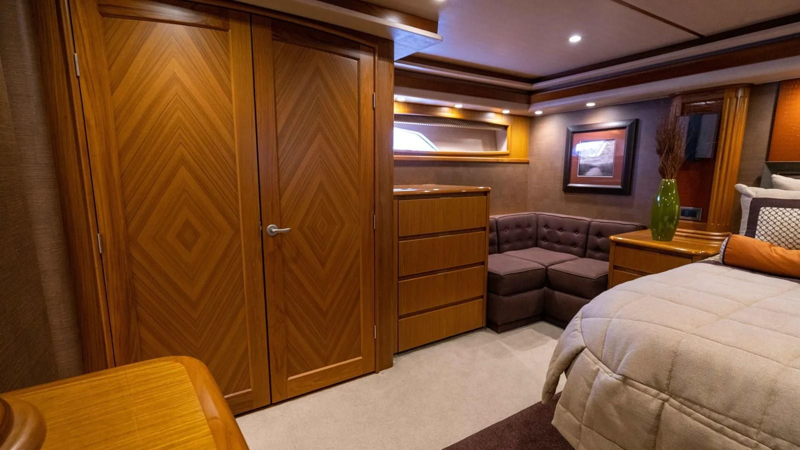 a room with a bed and a couch aboard DONE DEAL Yacht for Sale
