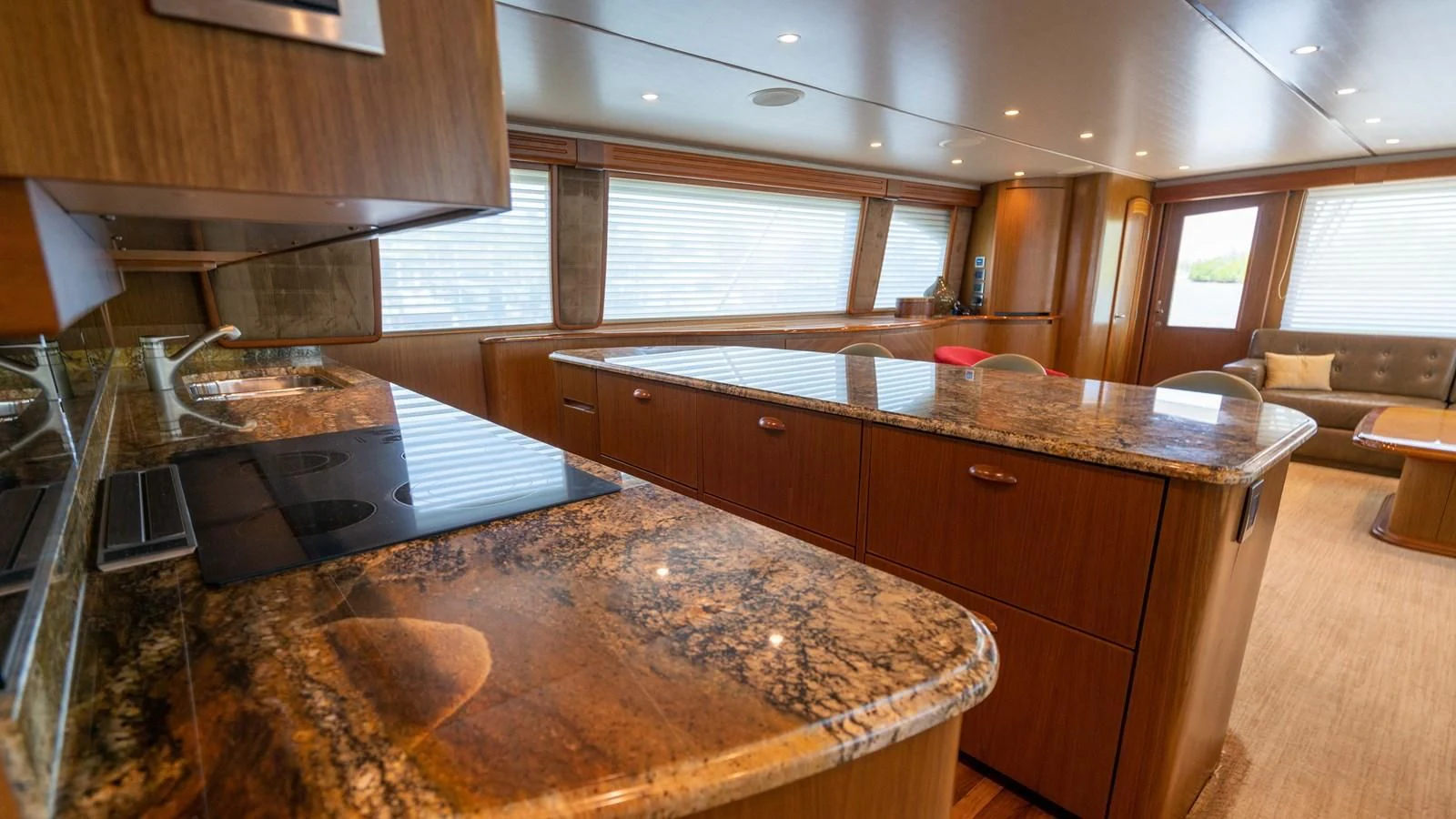 a kitchen with wooden cabinets aboard DONE DEAL Yacht for Sale