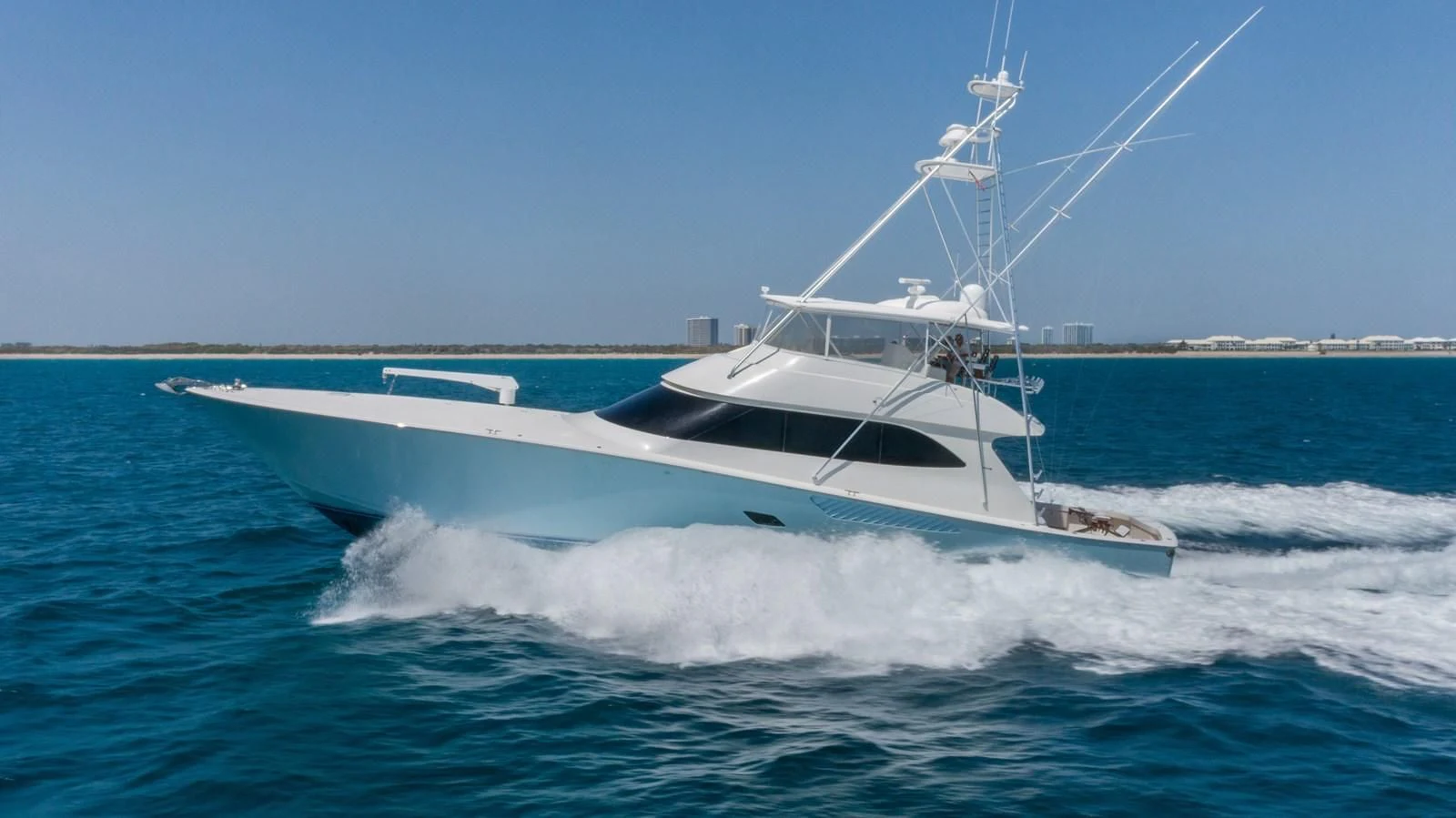 a white boat on the water aboard DONE DEAL Yacht for Sale
