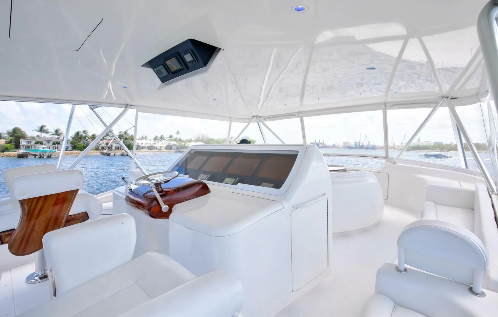 a white boat with a laptop on it aboard DONE DEAL Yacht for Sale