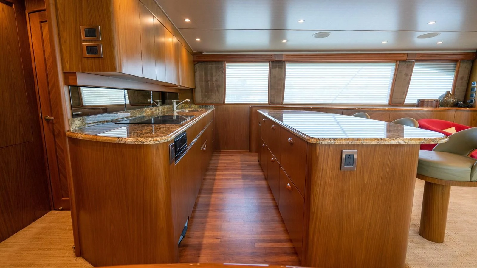 a kitchen with wooden cabinets aboard DONE DEAL Yacht for Sale