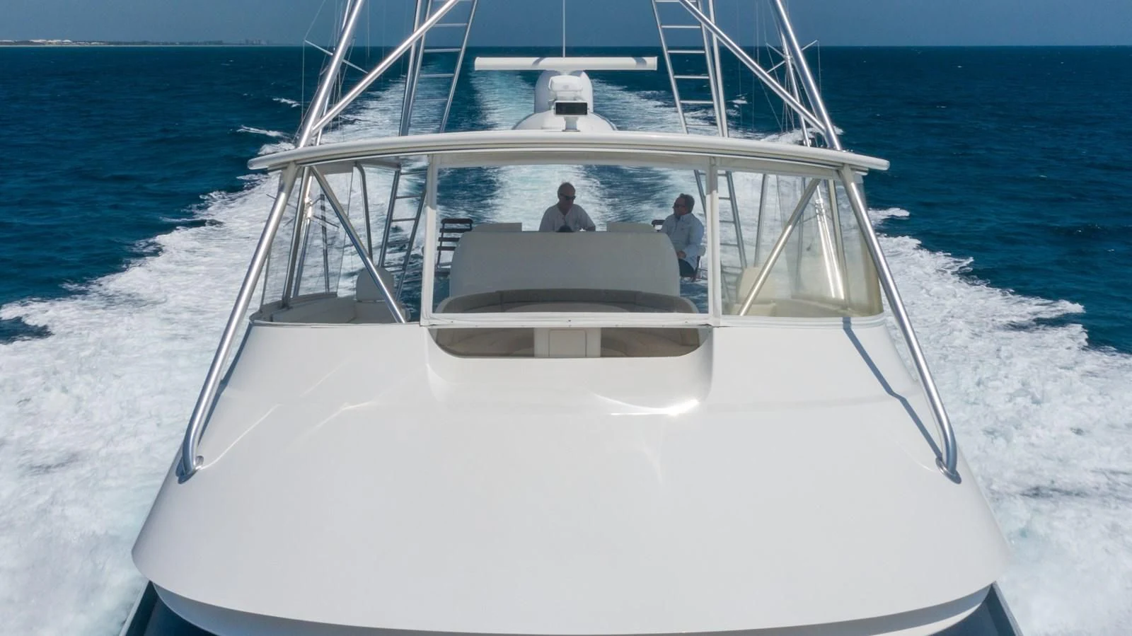 a white boat on the water aboard DONE DEAL Yacht for Sale