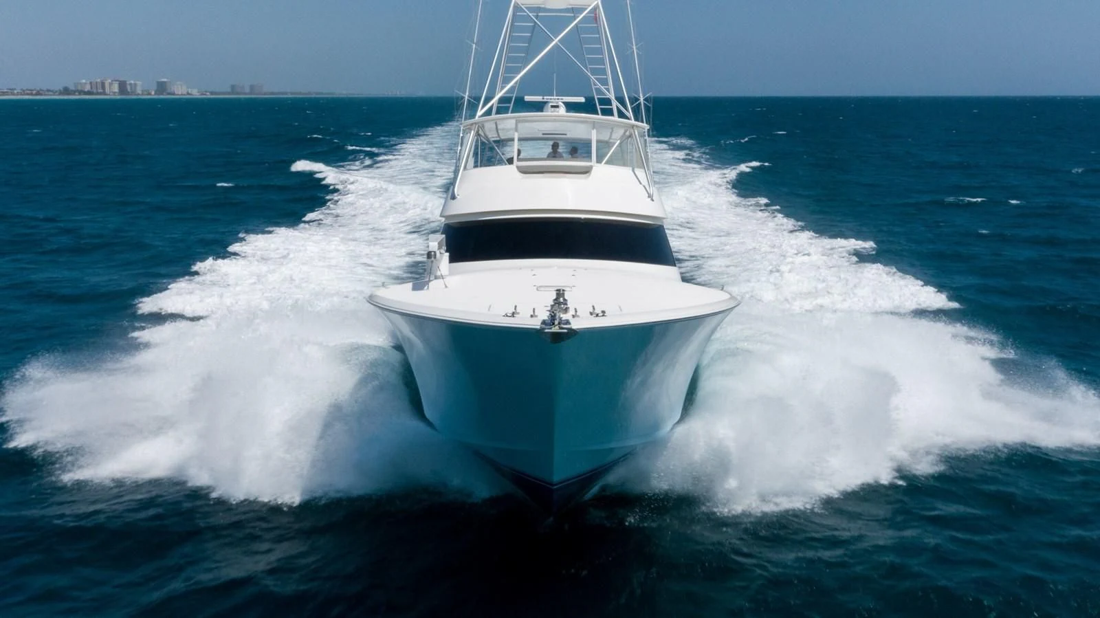 a white boat on the water aboard DONE DEAL Yacht for Sale