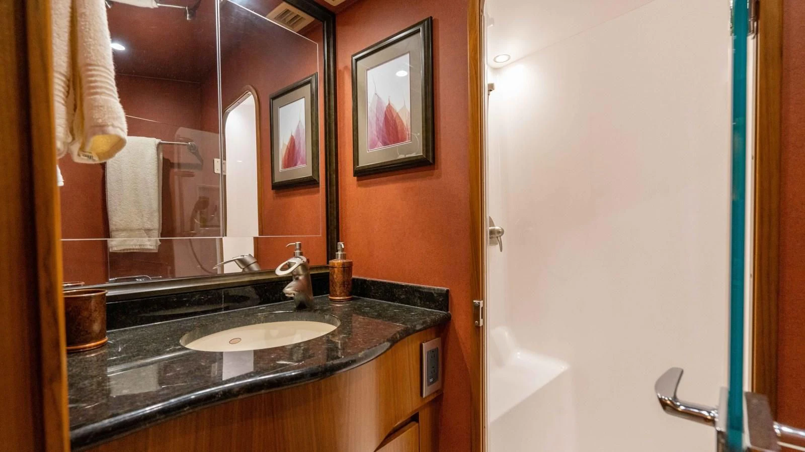 a bathroom with a sink and a mirror aboard DONE DEAL Yacht for Sale