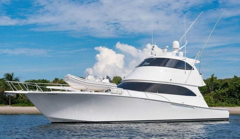a white yacht on the water aboard DONE DEAL Yacht for Sale