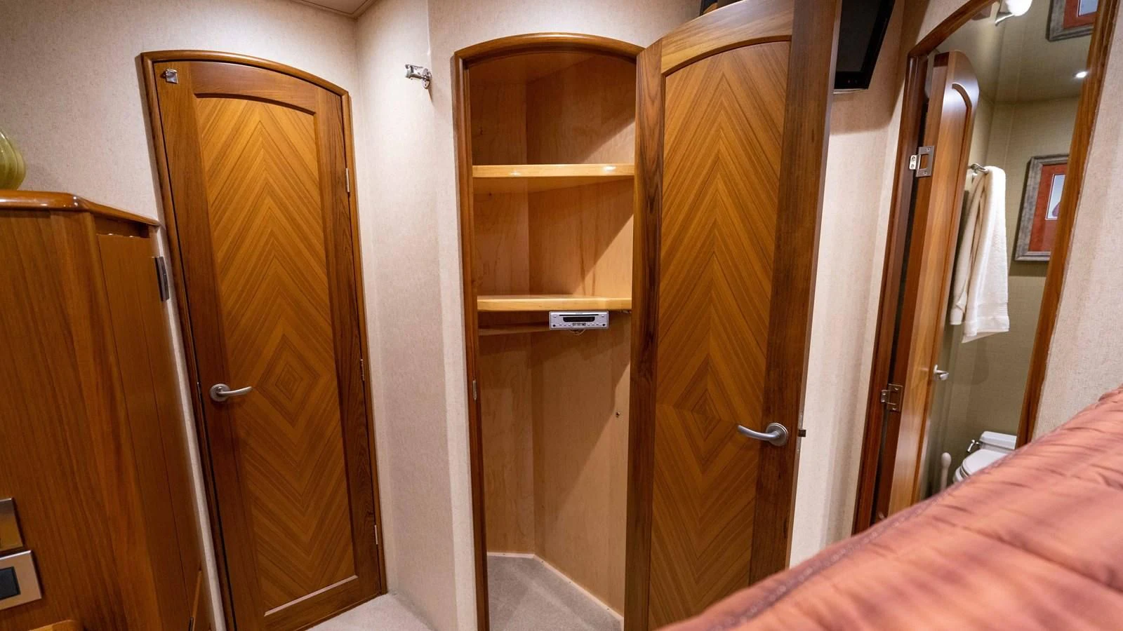 a room with a closet and a bed aboard DONE DEAL Yacht for Sale