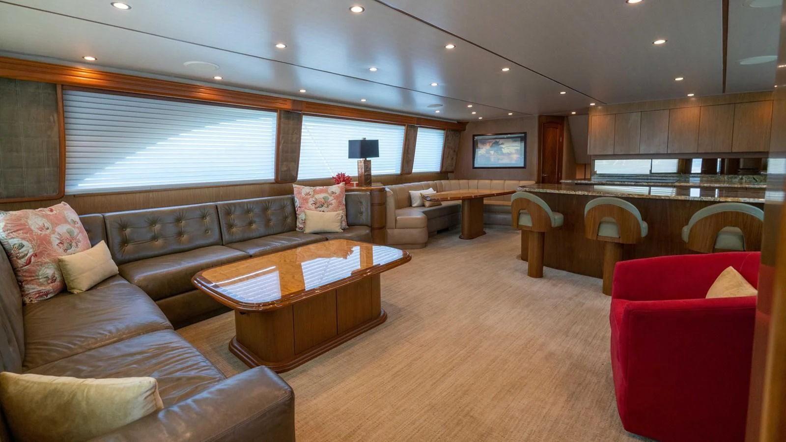 a living room with a leather couch and a wood coffee table aboard DONE DEAL Yacht for Sale