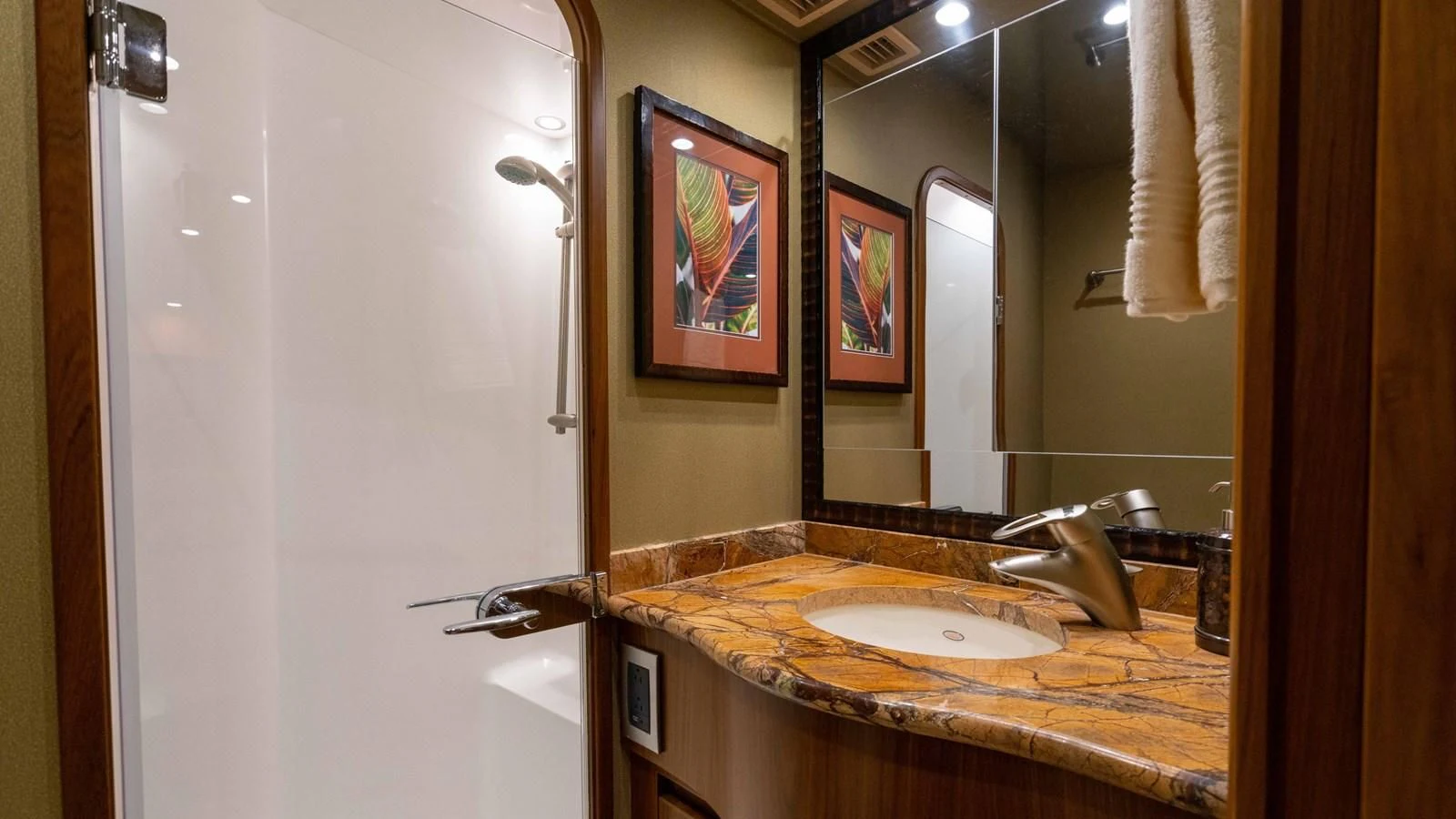 a bathroom with a sink and mirror aboard DONE DEAL Yacht for Sale