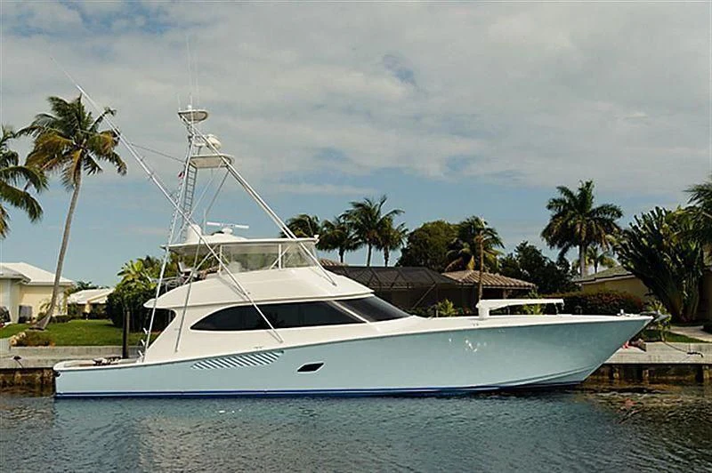 a white boat in a tropical area aboard DONE DEAL Yacht for Sale
