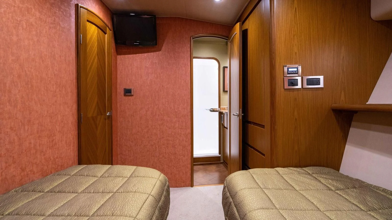 a room with two beds aboard DONE DEAL Yacht for Sale