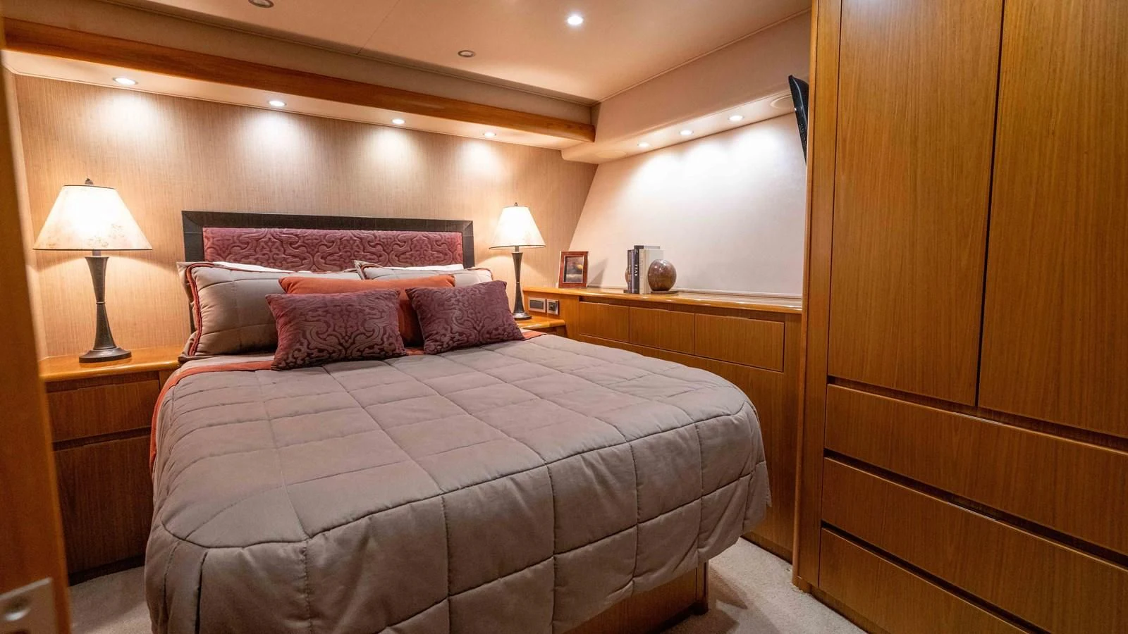 a bed with a lamp on it aboard DONE DEAL Yacht for Sale
