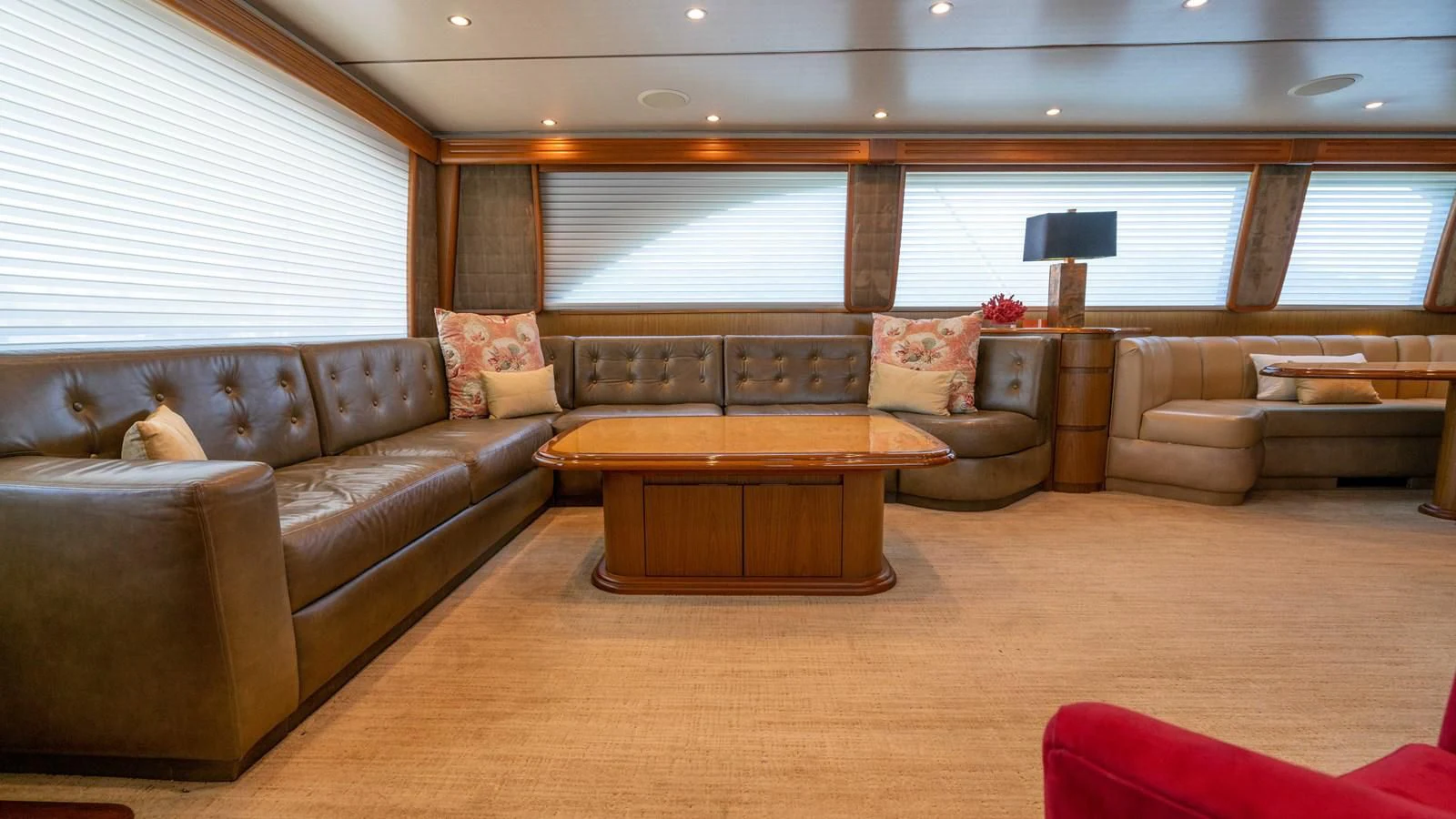 a living room with a leather couch and a table aboard DONE DEAL Yacht for Sale