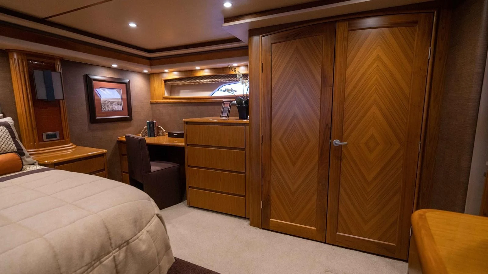 a room with a bed and a desk aboard DONE DEAL Yacht for Sale