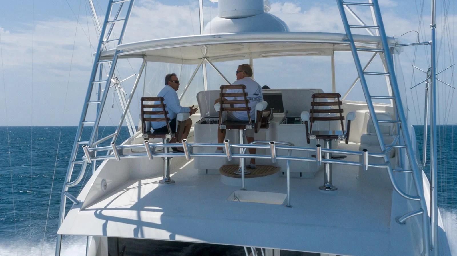 a couple of people sitting on a boat aboard DONE DEAL Yacht for Sale
