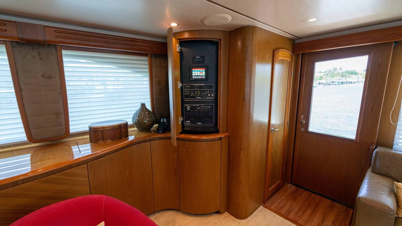 a room with a wood cabinet and a television aboard DONE DEAL Yacht for Sale