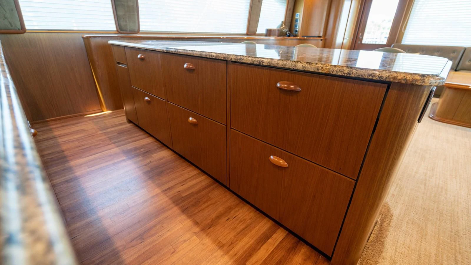 a kitchen with wooden cabinets aboard DONE DEAL Yacht for Sale