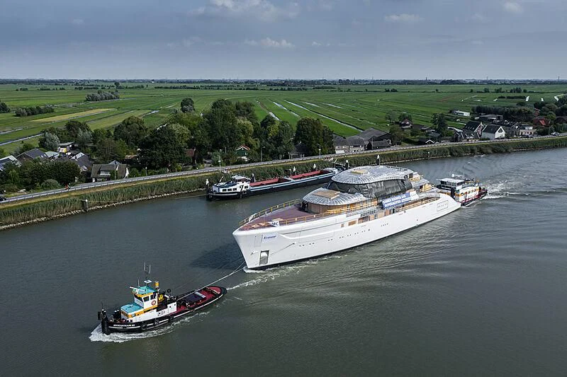 a river with boats and buildings along it aboard ALVIA Yacht for Sale