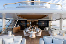 a room with tables and chairs aboard ALVIA Yacht for Sale