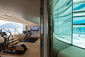 a room with a bench and a chair aboard ALVIA Yacht for Sale