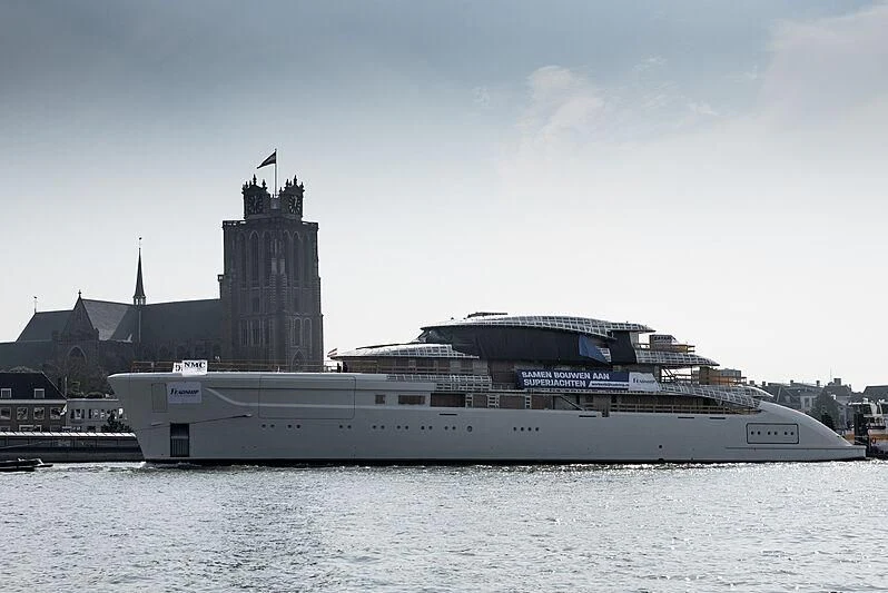 a large cruise ship in front of a large building aboard ALVIA Yacht for Sale