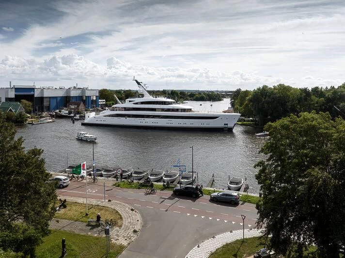 a large ship docked at a port aboard ALVIA Yacht for Sale