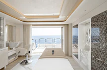 a room with a bed and a table aboard ALVIA Yacht for Sale