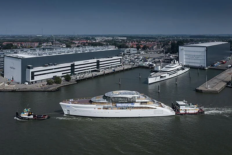 a large cruise ship docked at a port aboard ALVIA Yacht for Sale