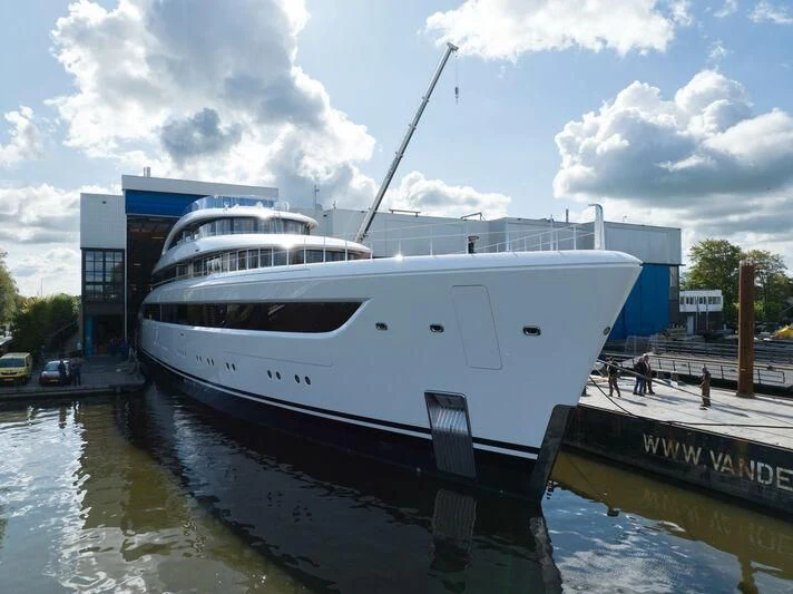 a large white boat docked at a dock aboard ALVIA Yacht for Sale