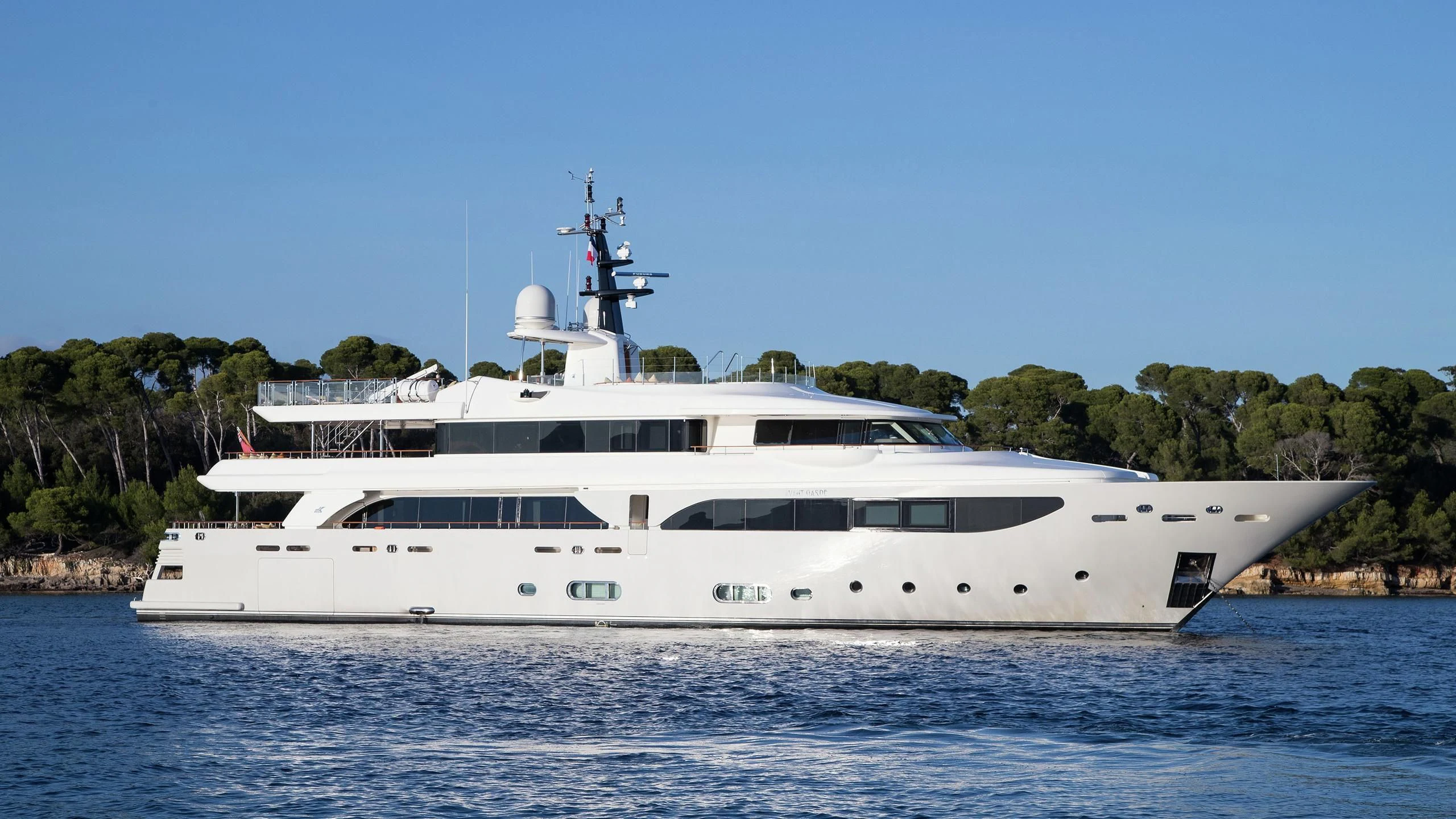 a white yacht in the water aboard PHOTON Yacht for Sale