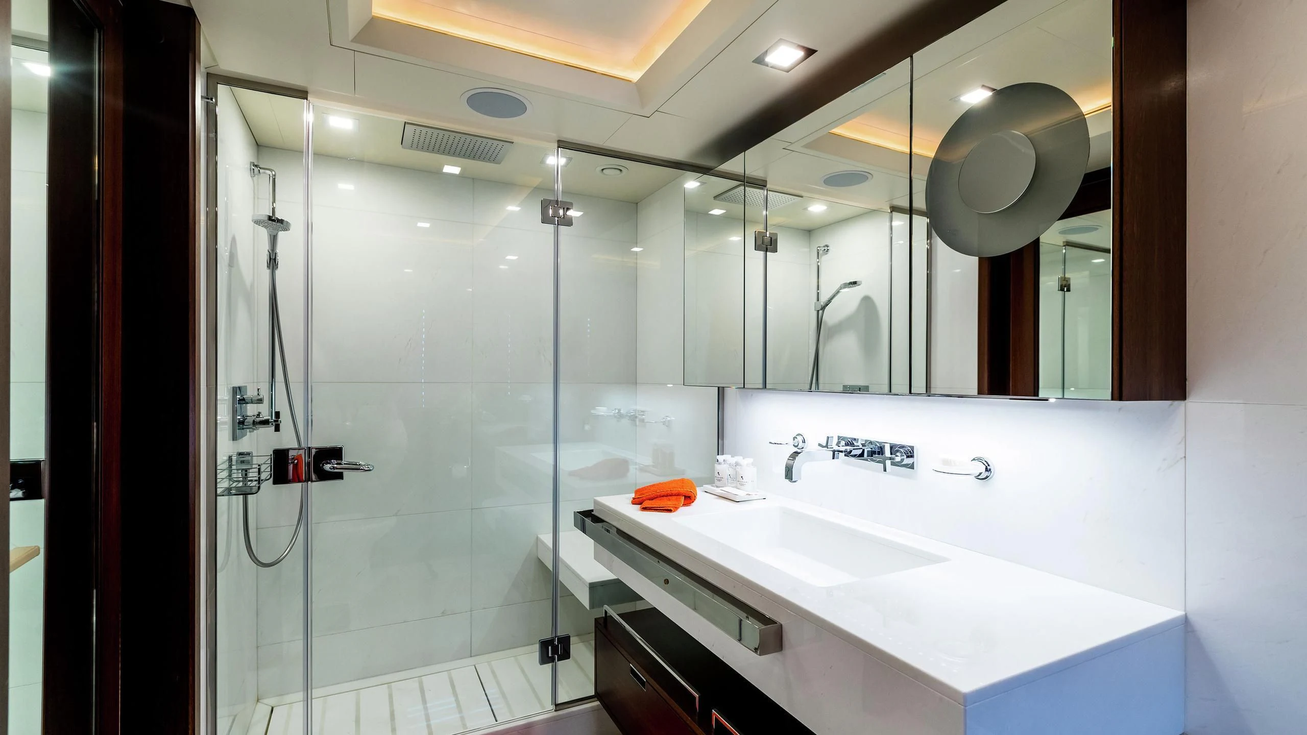 a bathroom with a glass shower aboard PHOTON Yacht for Sale
