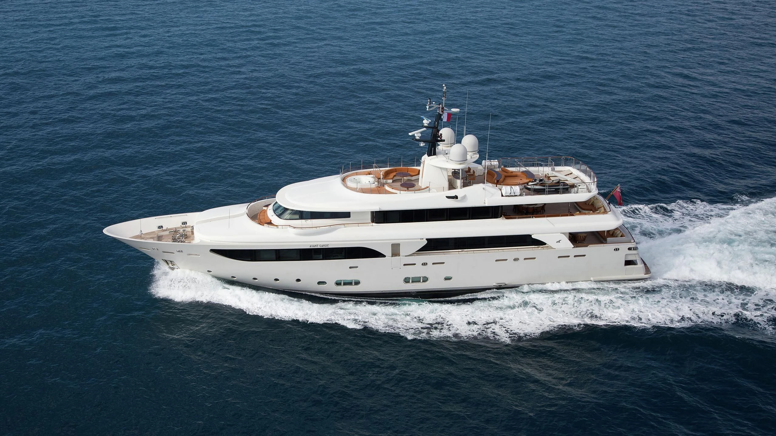 a white yacht on the water aboard PHOTON Yacht for Sale