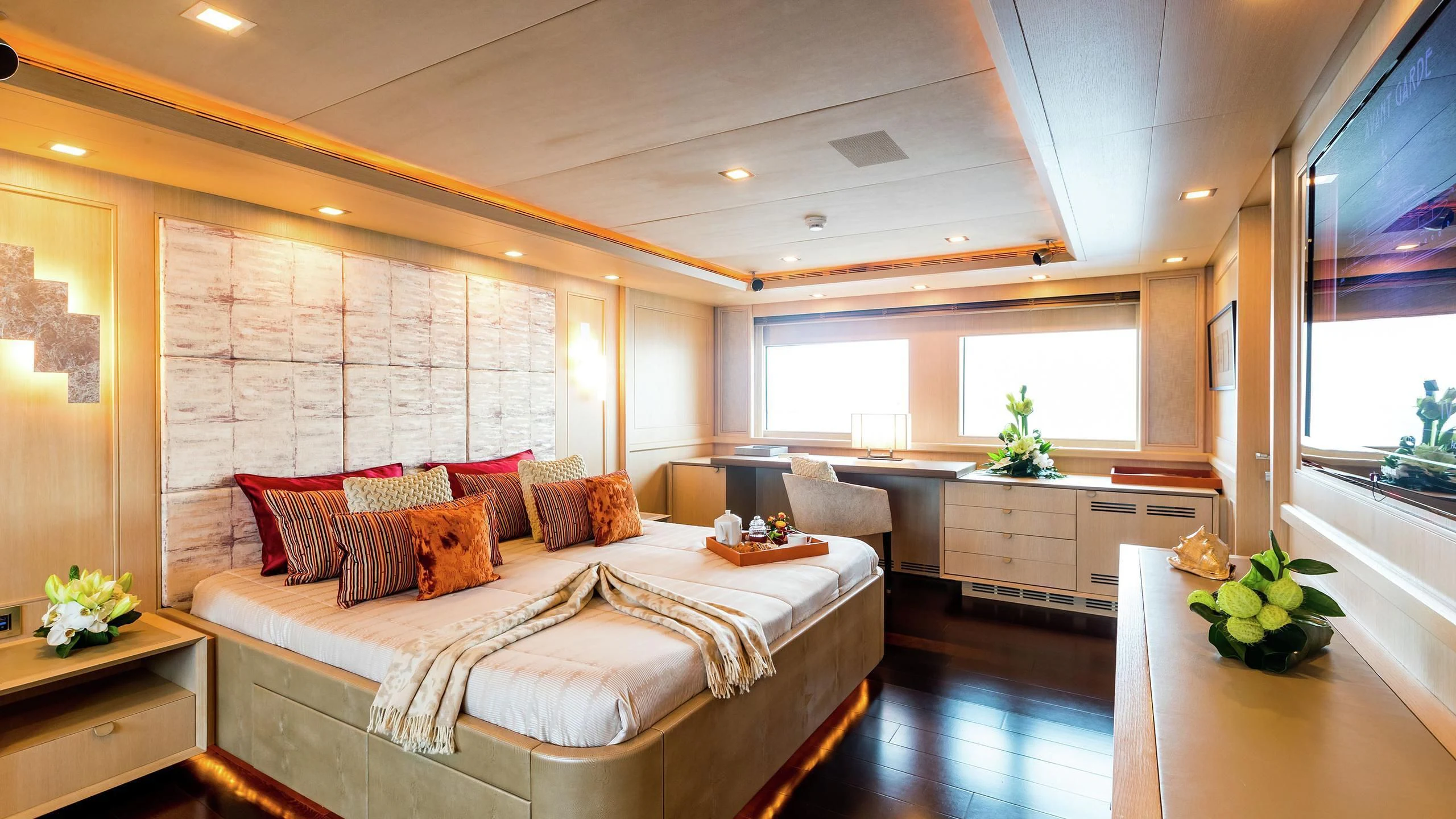 a large bedroom with a large bed aboard PHOTON Yacht for Sale