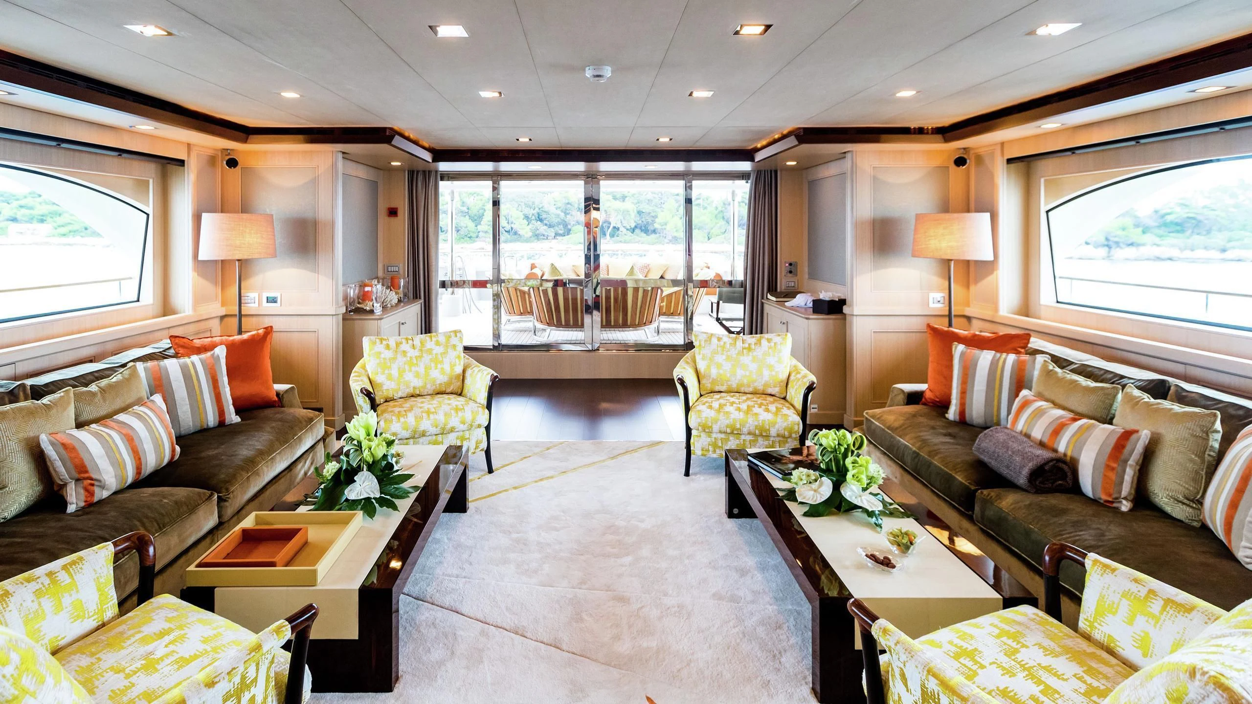 a living room with a large window aboard PHOTON Yacht for Sale