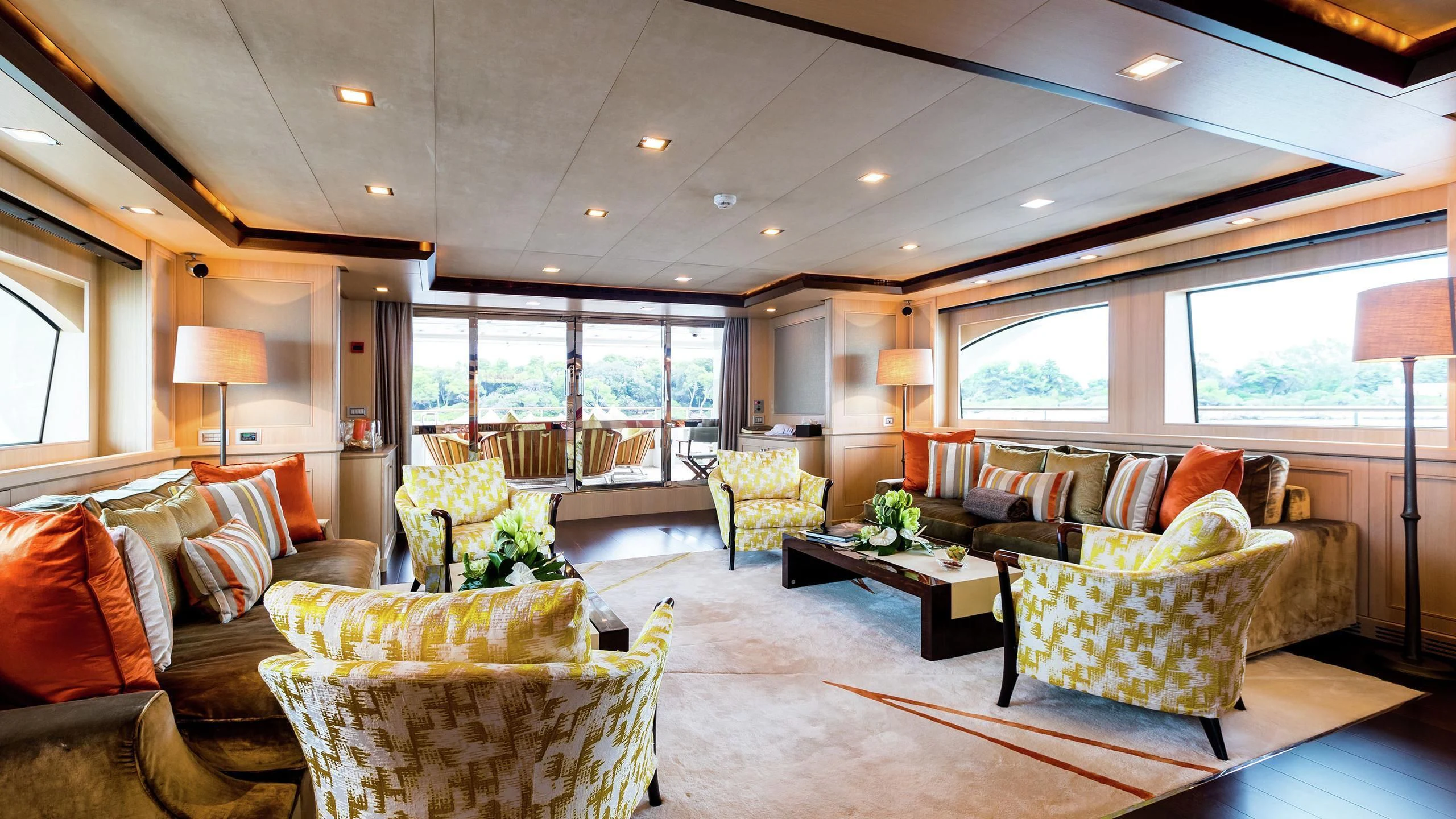 a living room with a large window aboard PHOTON Yacht for Sale