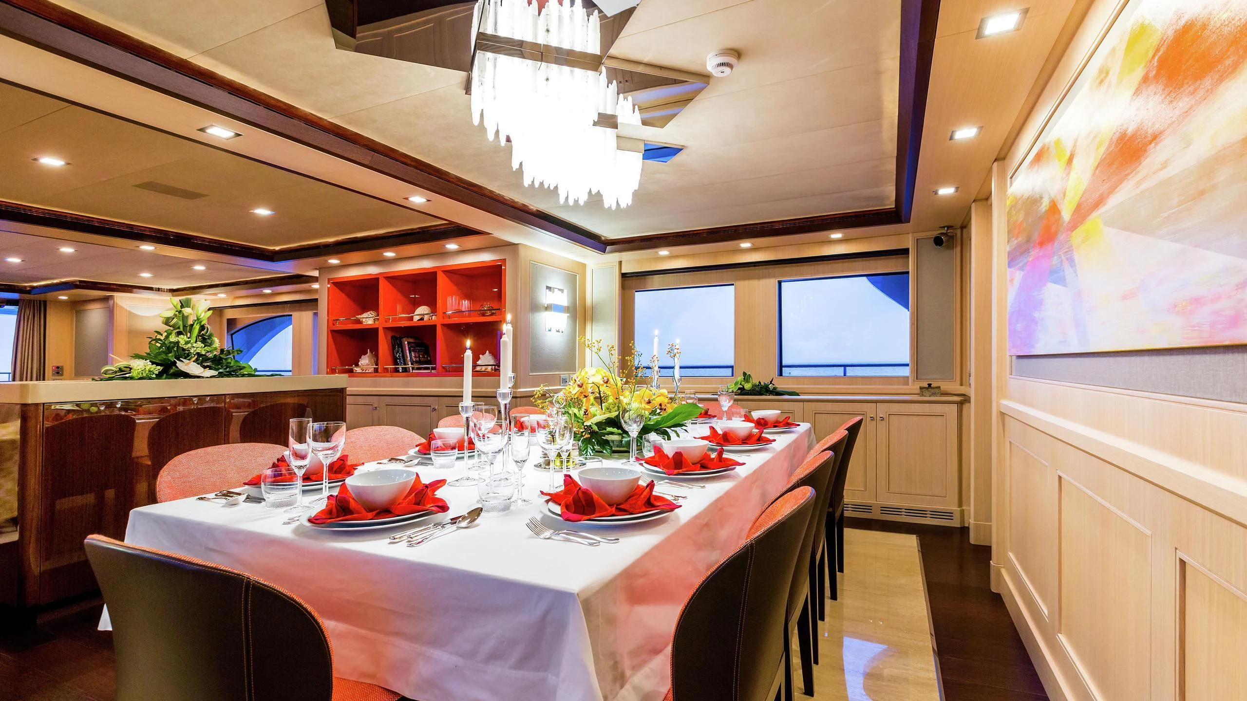 a dining room with a table set aboard PHOTON Yacht for Sale