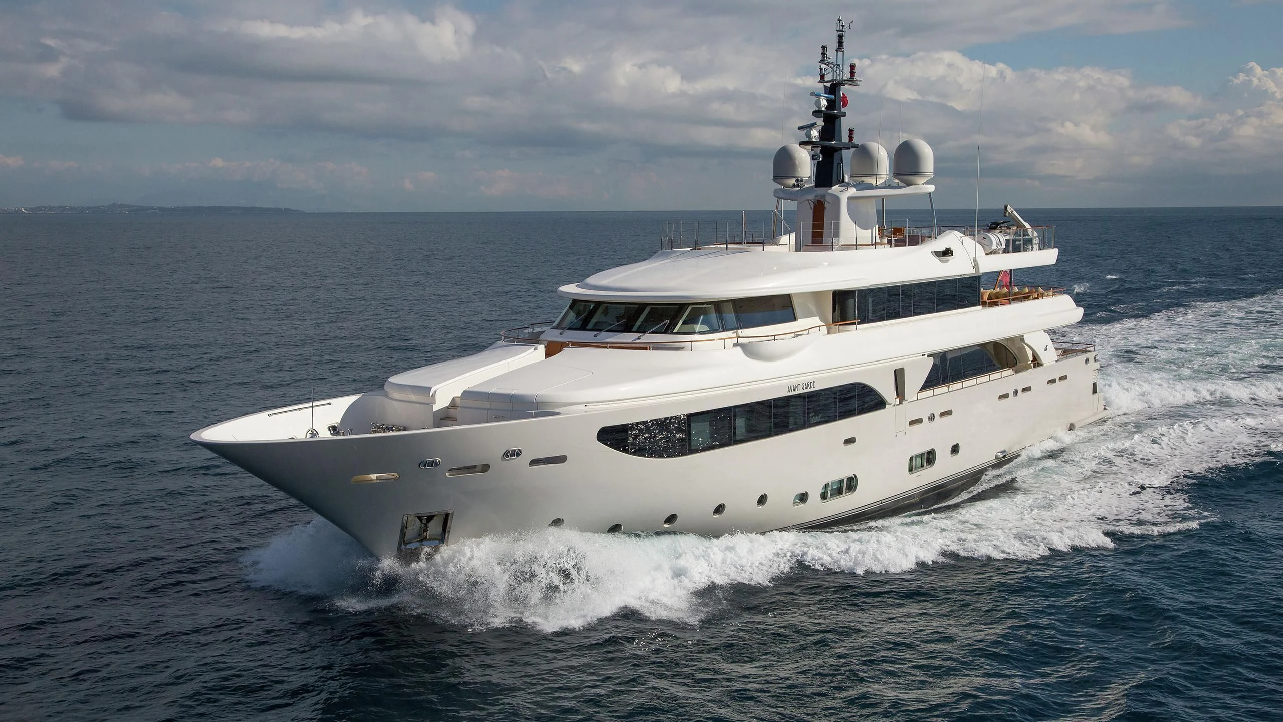 a white boat on the water aboard PHOTON Yacht for Sale