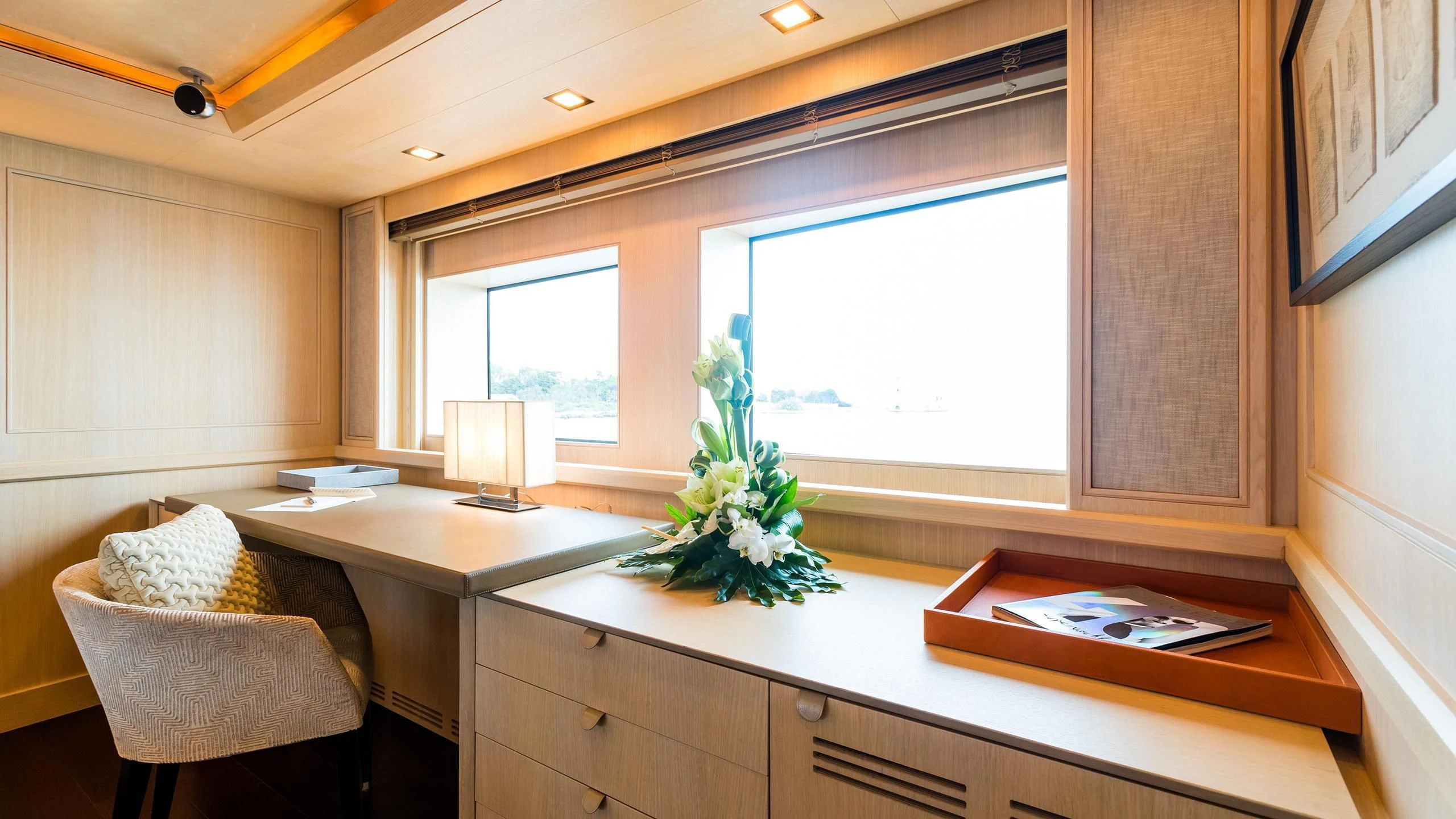 a room with a desk and a window aboard PHOTON Yacht for Sale