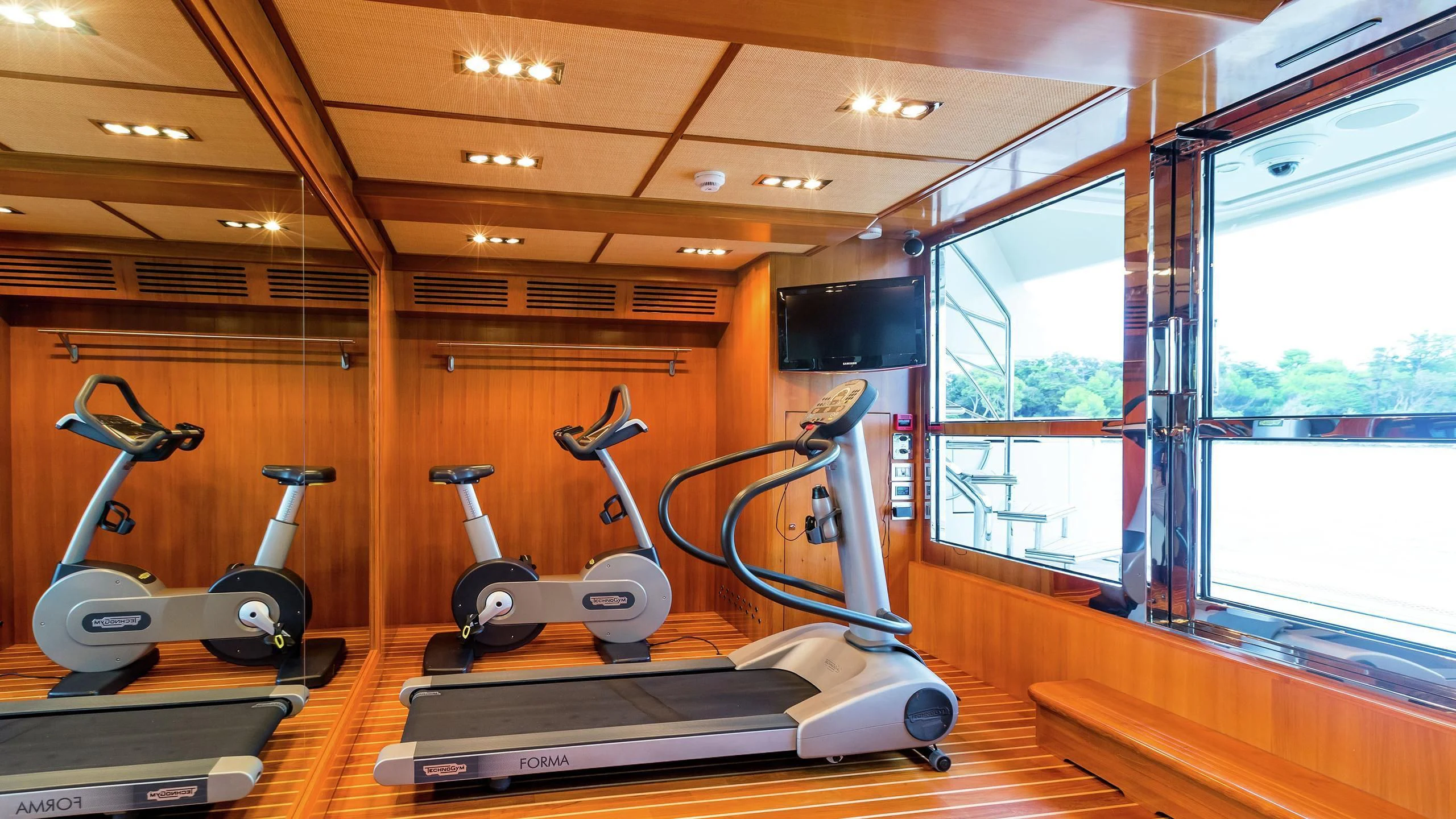 exercise equipment in a room aboard PHOTON Yacht for Sale