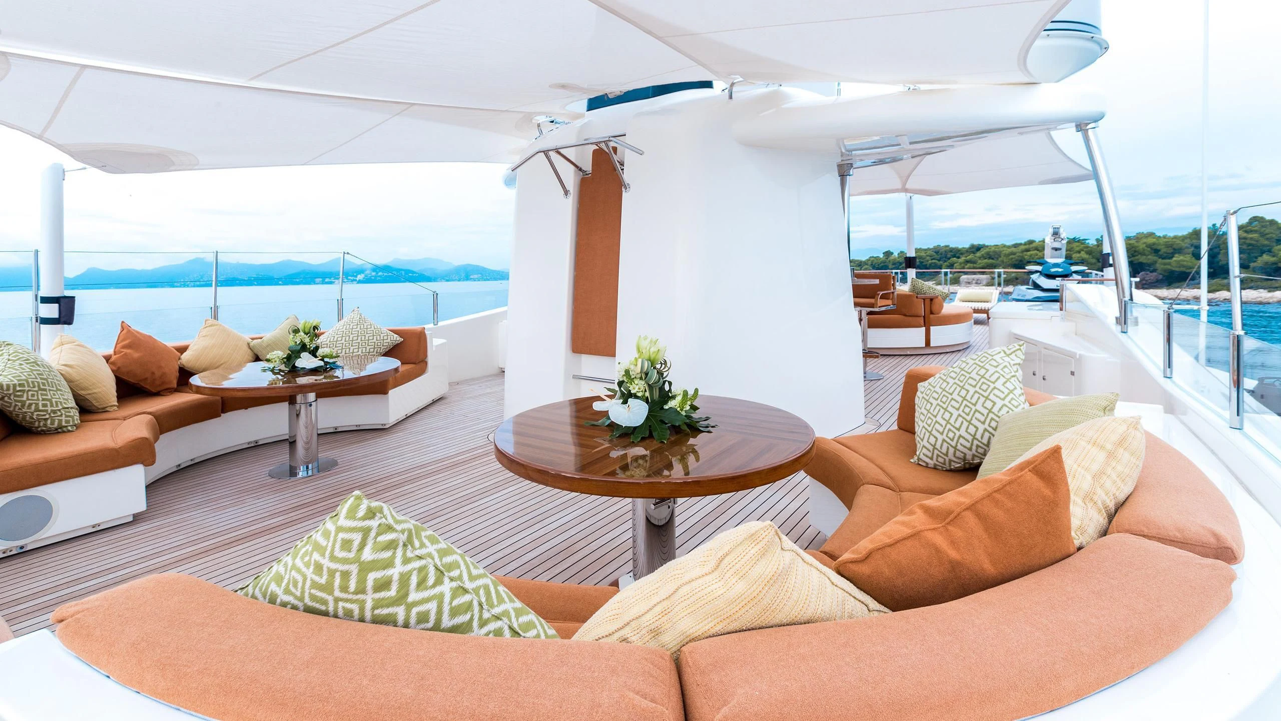 a living room with a large patio aboard PHOTON Yacht for Sale