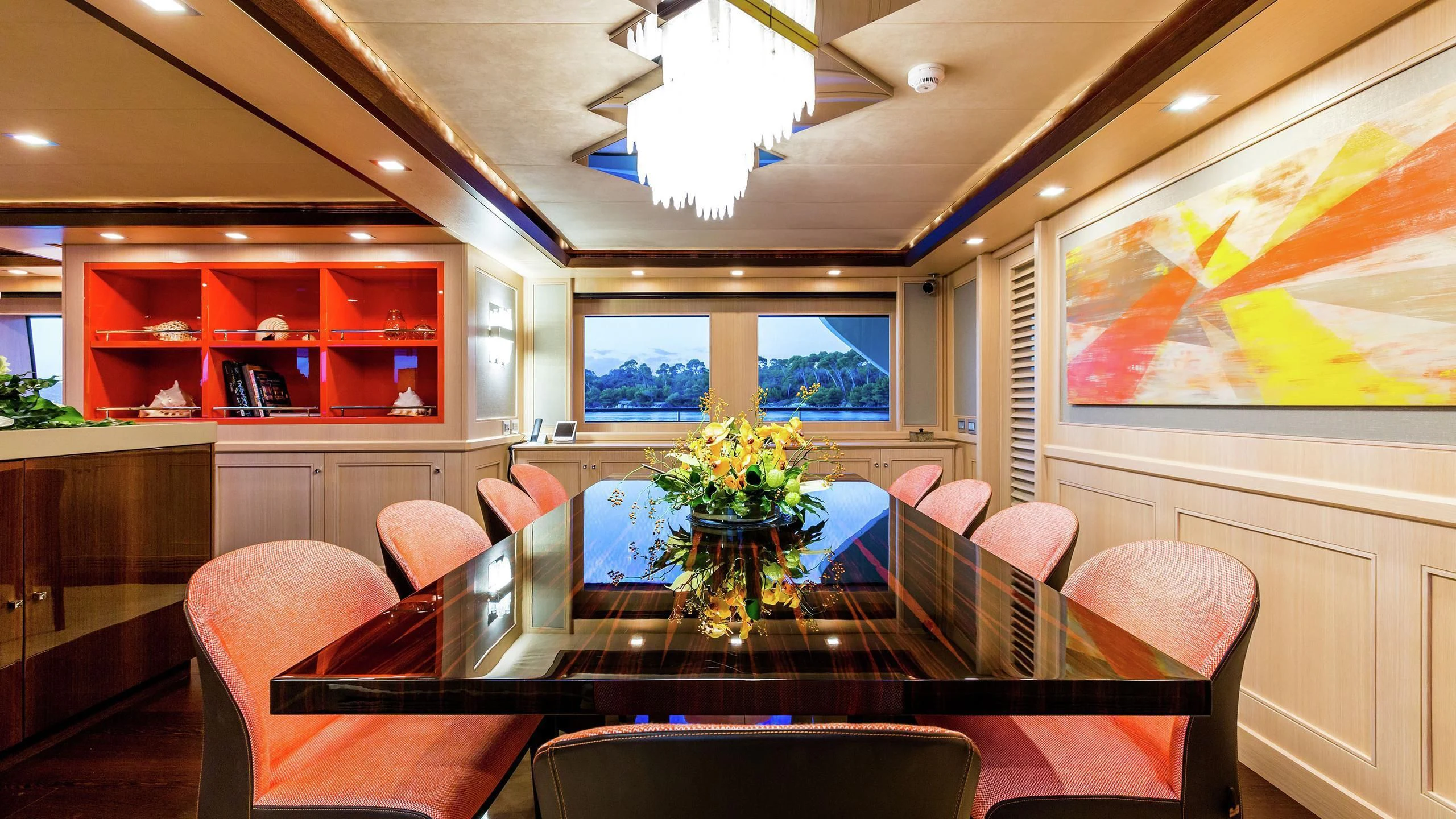 a room with a table and chairs aboard PHOTON Yacht for Sale